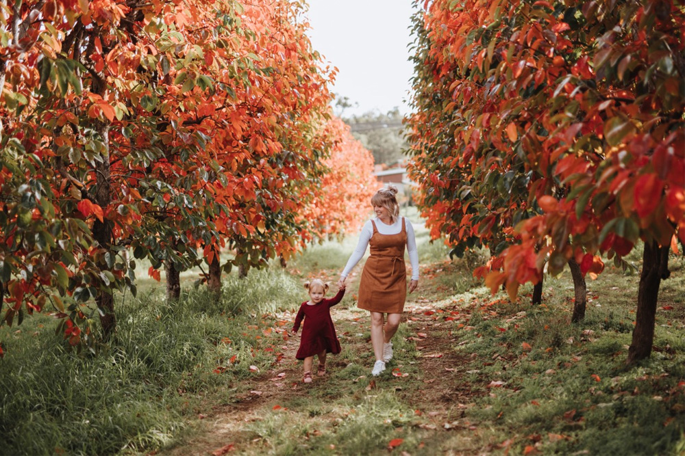 Mother and Daughter in the autumn leaves